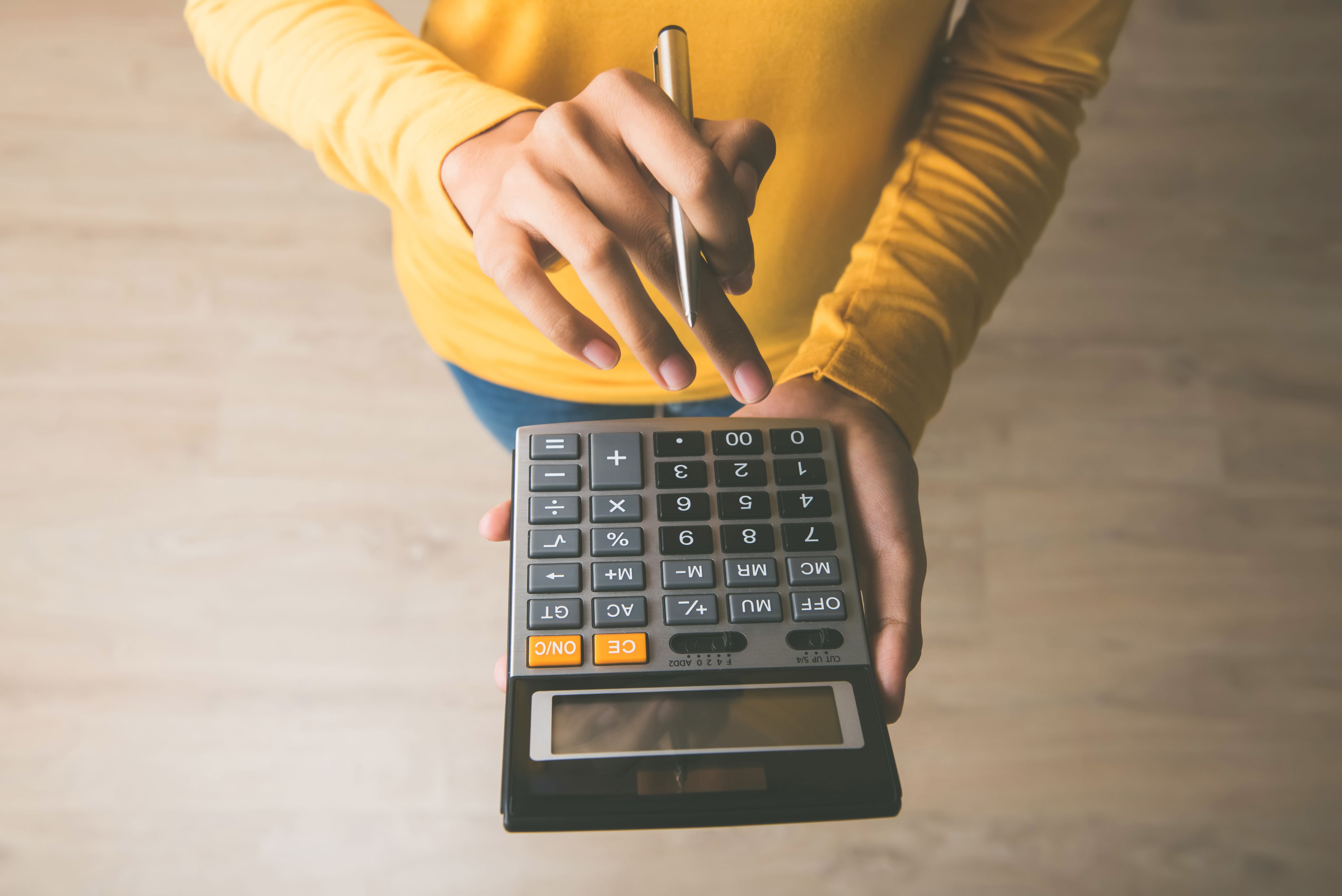 A woman using a calculator
