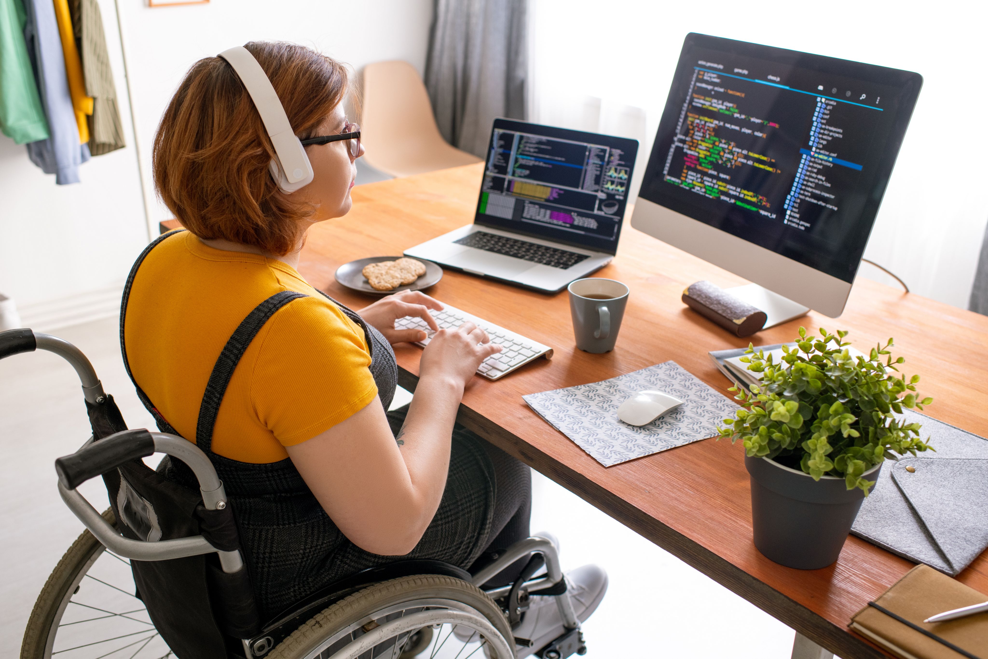 A disabled woman writing code
